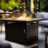 Beautifully showcased aluminum 48-inch rectangular propane fire pit table with sofas and greenery in the background, perfect for Oakville, Ontario patios.