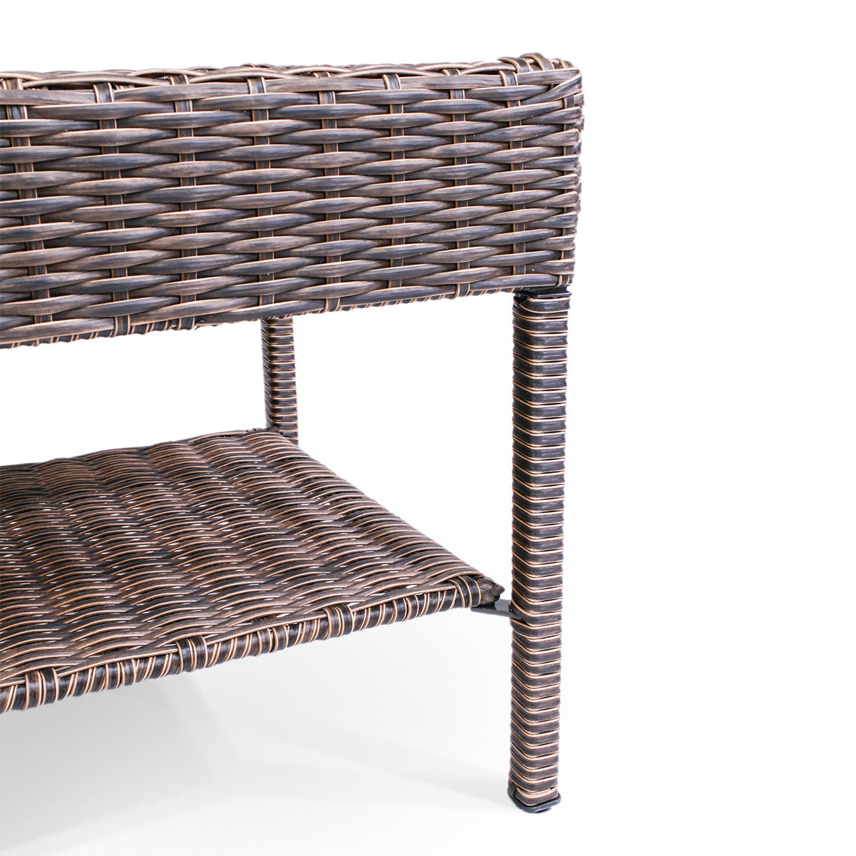 Side close-up view of Cambridge Wicker Outdoor Coffee Table, highlighting the sturdy leg design and built-in shelf for added storage.