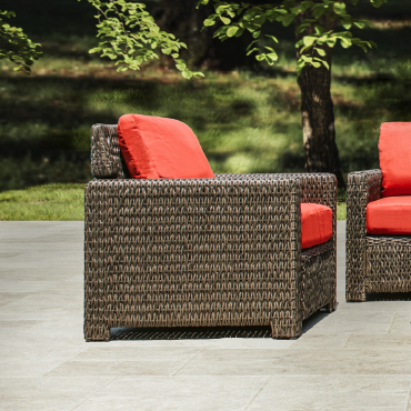 Side angle view of Laguna Point 4-Piece Wicker Outdoor Conversational Set emphasizing the modern design, powder-coated steel frame, and plush cushions for added comfort, Oakville, ON.