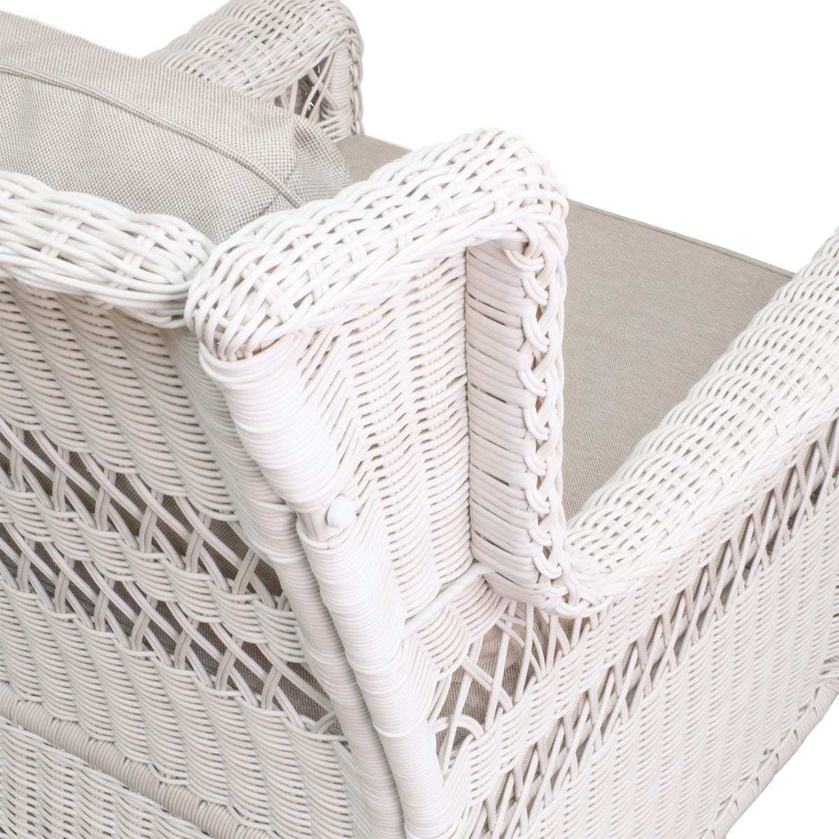 Close-up of Park Meadows Outdoor Chair highlighting the shoulder and detailed weave of the white cream wicker, showcasing fine craftsmanship.