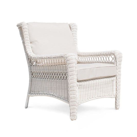 Park Meadows Wicker Outdoor Club Chair shown from right corner side, full view showcasing the white cream finish, diamond weave details, and wide arms. Oakville, ON.