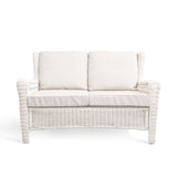 Park Meadows Wicker Outdoor Loveseat with plush cushions and diamond weave details, outdoor setting in Oakville, ON.