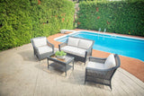 Camus 4-Piece Wicker Outdoor Conversational Set with Sunbrella® Cushions, 2 club chairs, sofa, coffee table, all-weather wicker, pool in background.