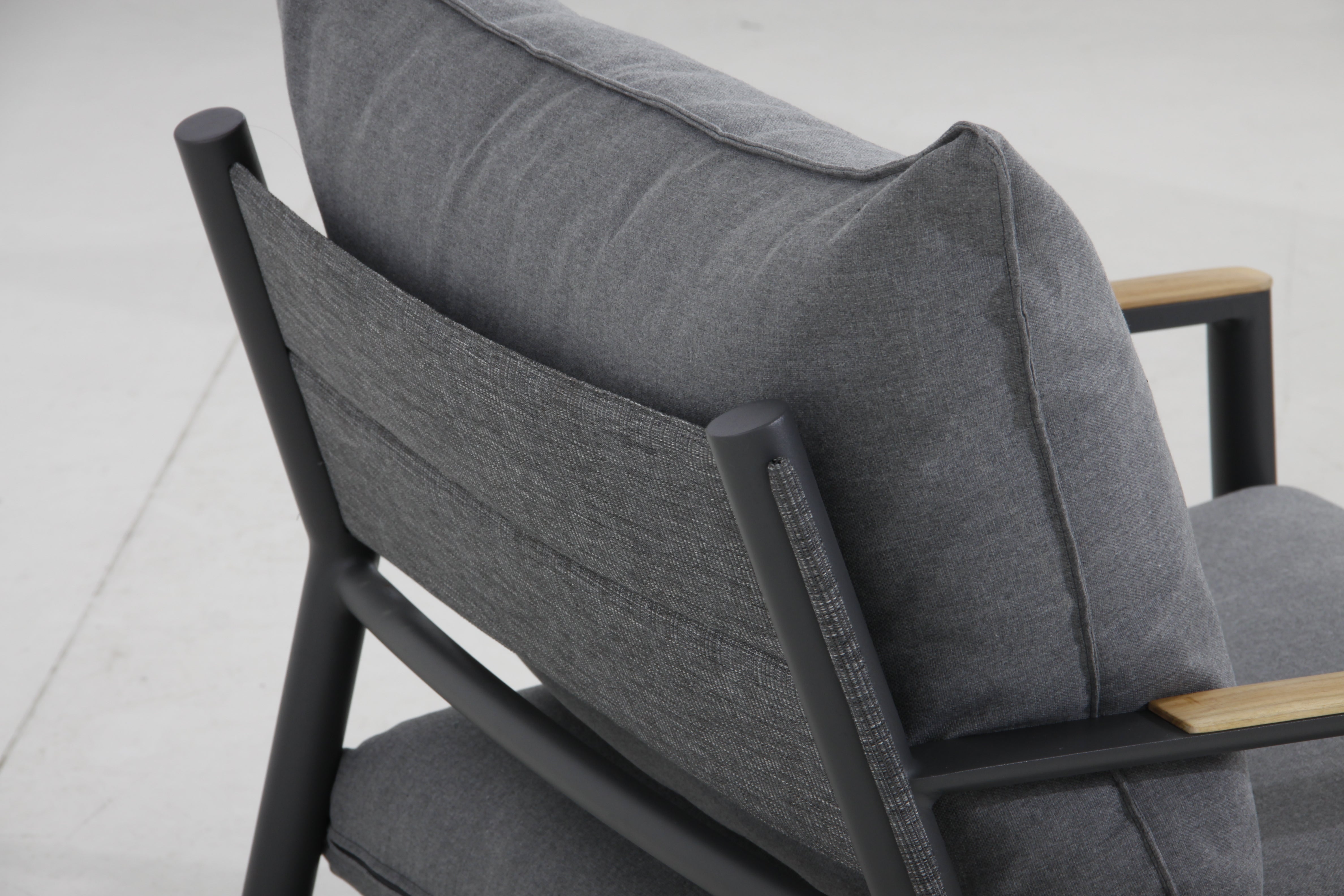 Back view of the Monti club chair showcasing the cushioned backrest with Sunproof® VENAO fabric in Oakville.