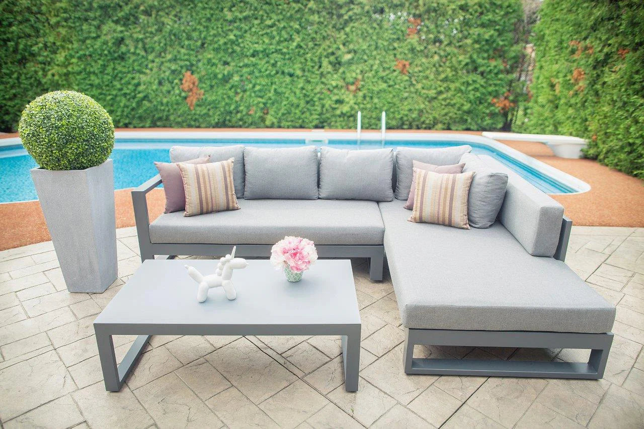 Close-up view of the full sectional set, highlighting its modern design and comfortable seating, set against the serene poolside location.