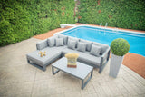 A cozy sectional set with teak wood accents, perfect for outdoor lounging near the pool, offering comfort and style in a compact design.